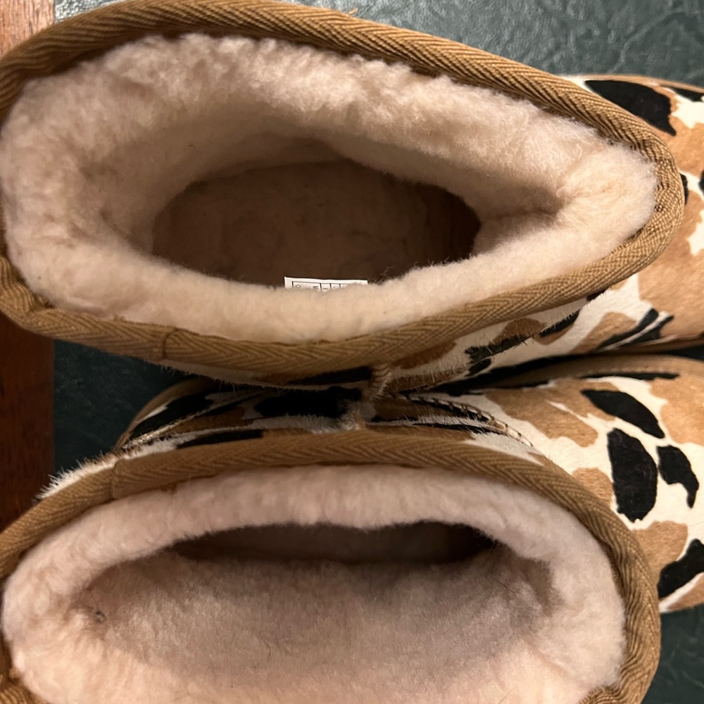Ugg cow print mini boot
